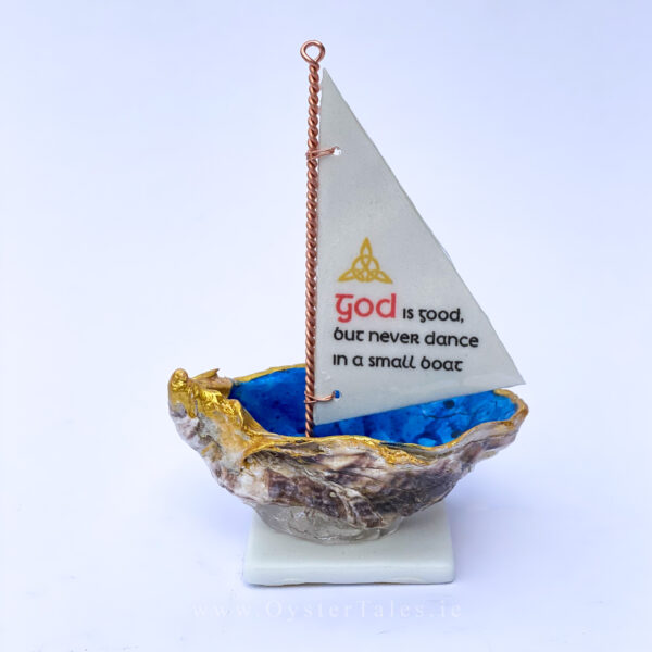 God is good but never dance in a small boat. Oyster shell sailing boat
