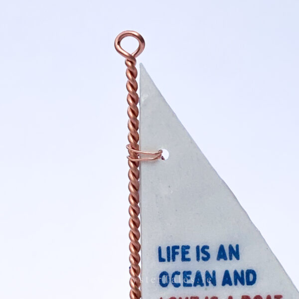 A unique ornament that transforms a real Galway Bay oyster shell into a miniature sailing boat.